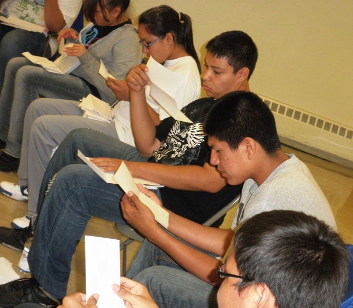 Lakota youth reading letters at St. Joseph's retreat