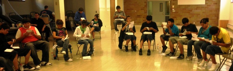 Lakota youth reading letters at St. Joseph's retreat