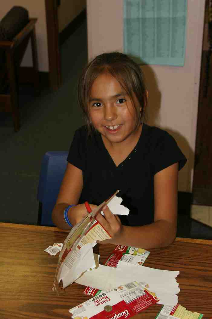 Cutting Campbell's soup labels at St. Joseph's Indian School!