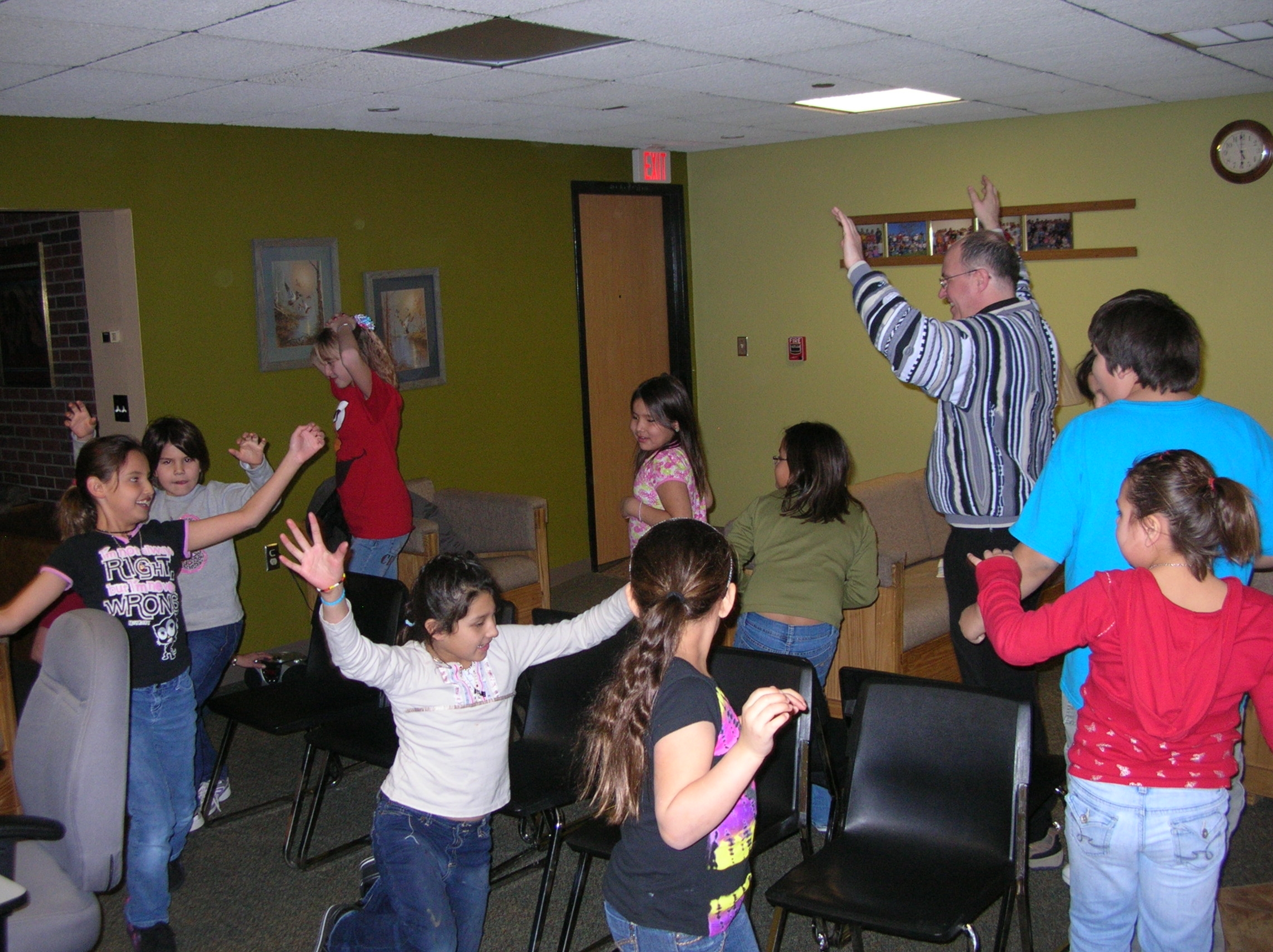 Fr. Steve and some Native American children play musical chairs! 