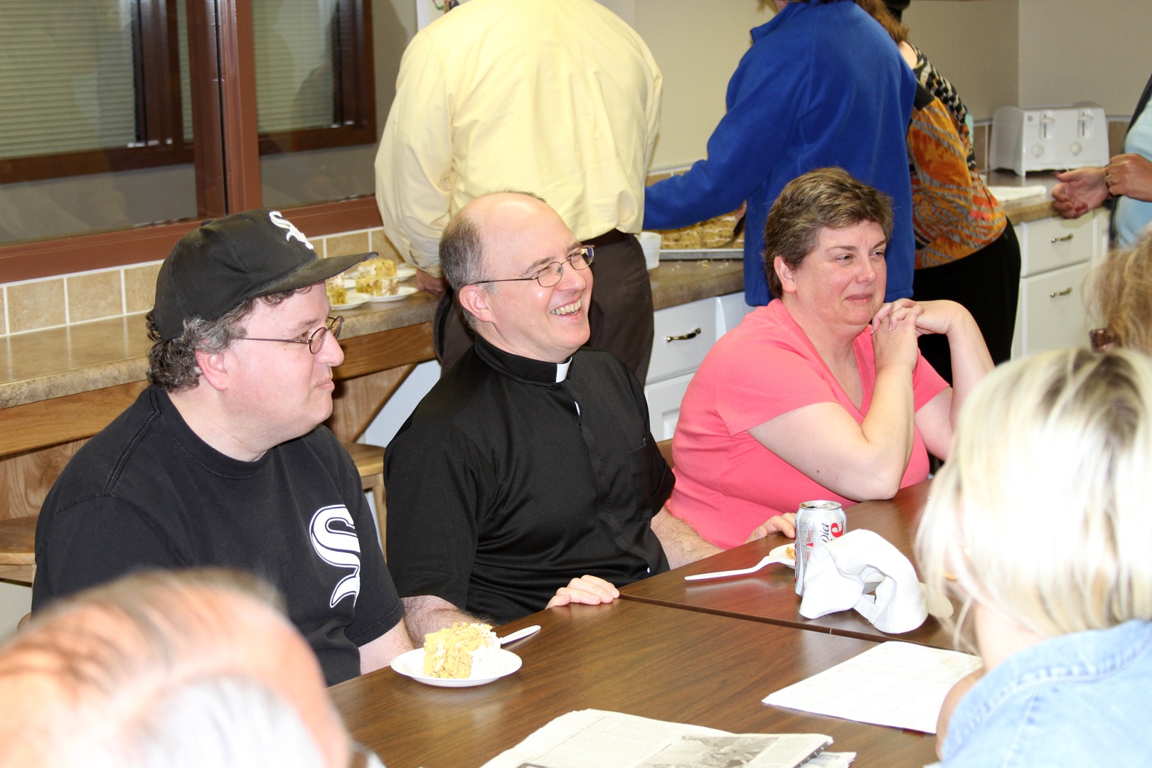 Fr. Steve and his family enjoy some birthday cake!