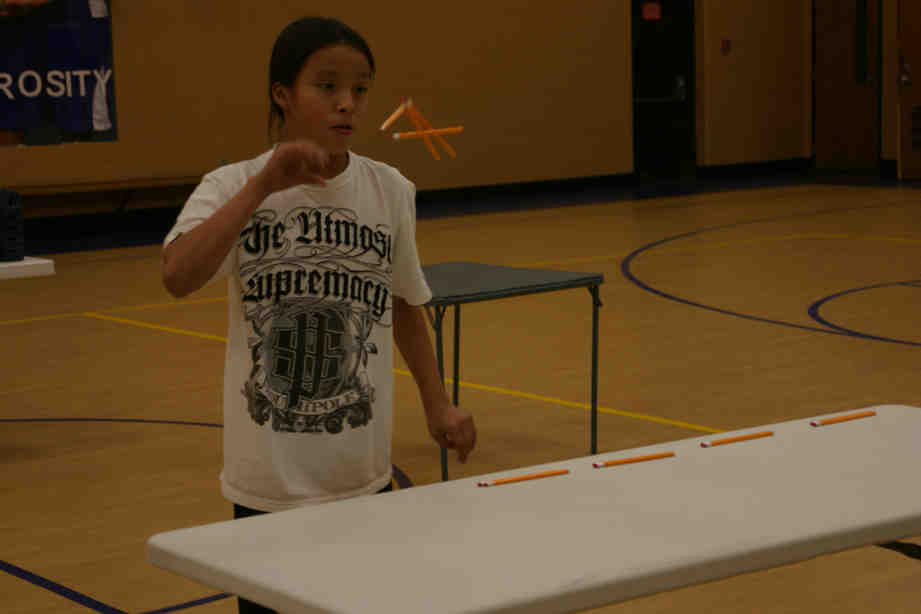 John playing a "Minute To Win It" game. 