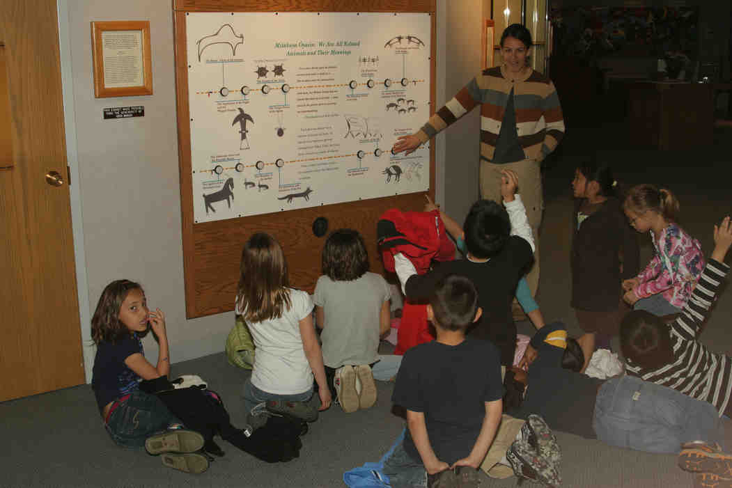 Native American children learning about their culture. 