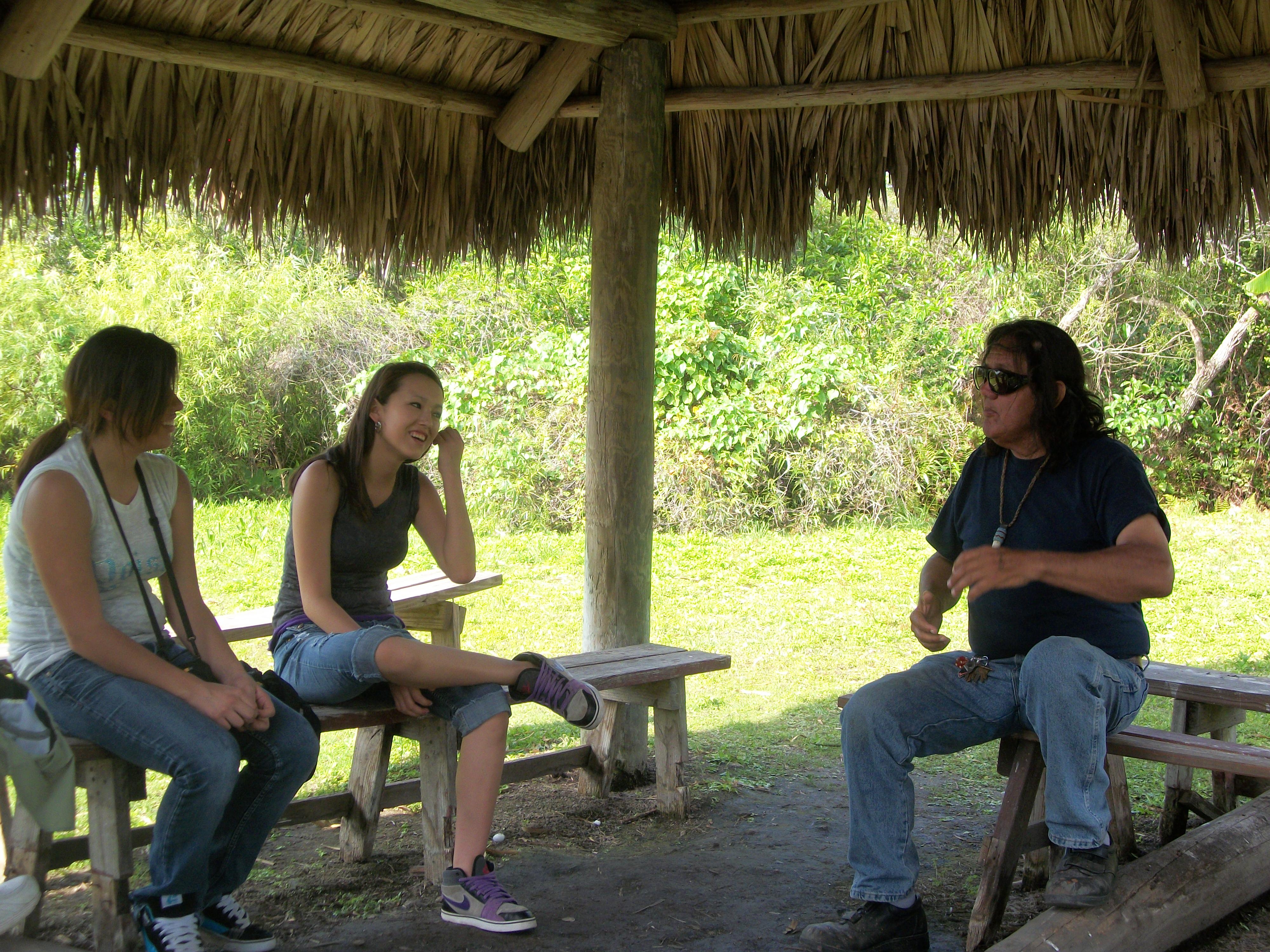 Two Native American girls enjoying the company of their tour guide. 