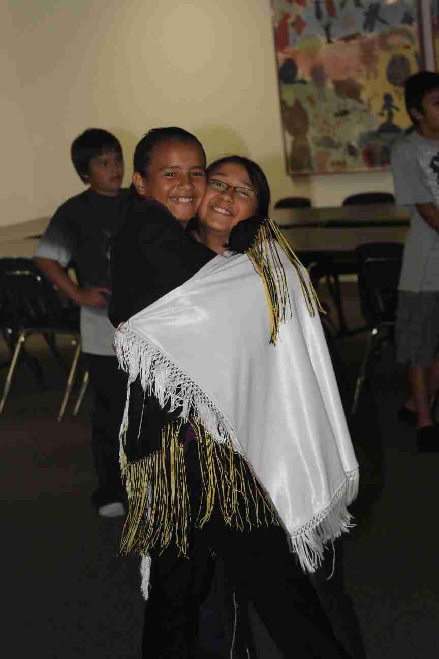 Two Native American girls take a break from powwow practice!