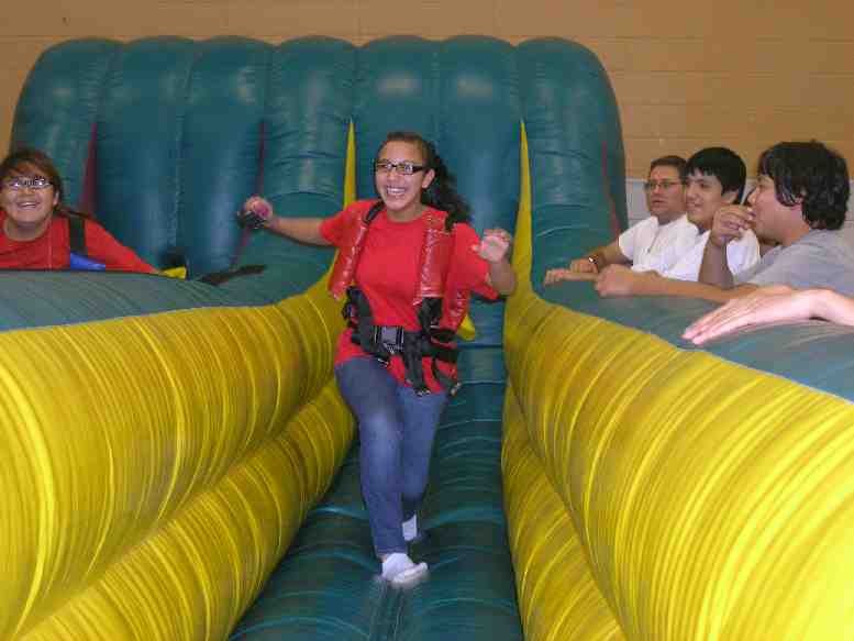 Native American students race each other on the bungee run during Red Ribbon Week. 