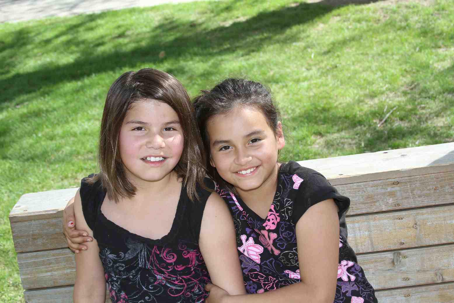 Two St. Joseph's Indian School girls wait for their soccer game to start. 