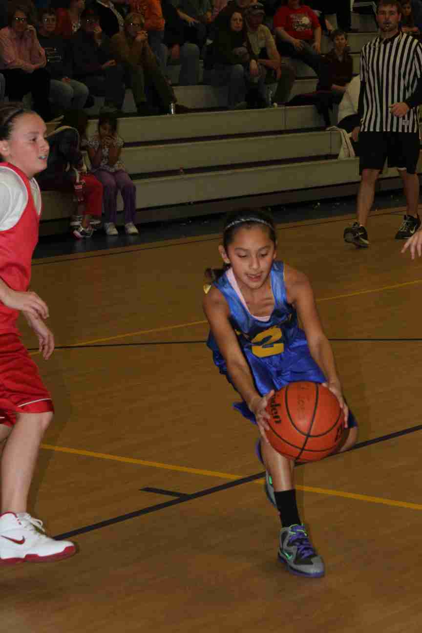 Kira grabs a loose ball in her last basketball game!