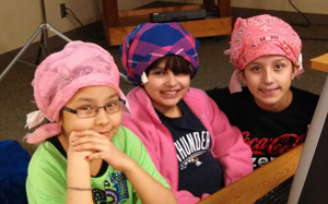 At St. Joseph’s community hair shop, the girls wait for their styles to set. 