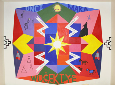 St. Joseph’s art room has a new mural, thanks to the Lakota children and artist Markus Tracy.