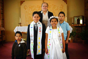 The Lakota (Sioux) children at St. Joseph’s participate in the Rites of Initiation with the support of their families. 