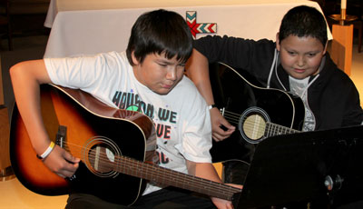 The Lakota children at St. Joseph’s have the opportunity to take music lessons. 