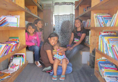 St. Joseph’s van is lined with books for the Native American children to choose from. 