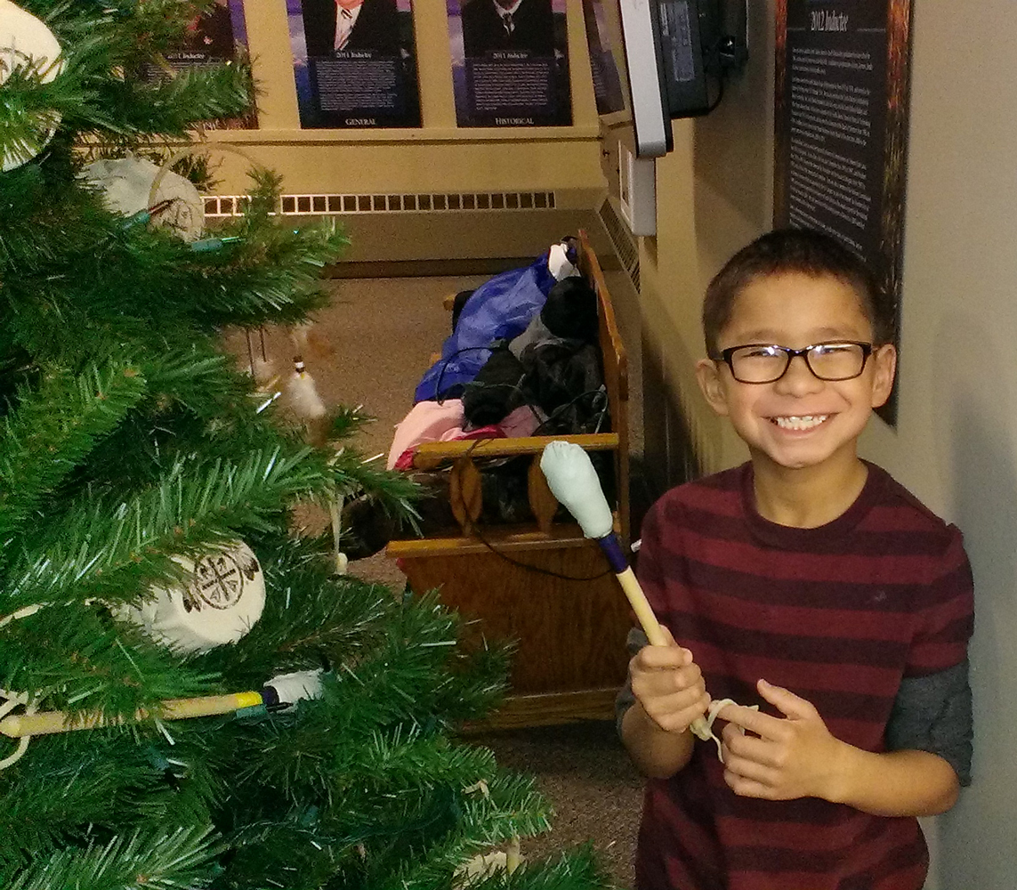 The Lakota children decorated a Christmas tree at the South Dakota Hall of Fame.