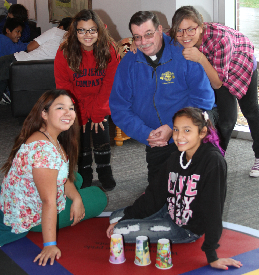 Fr. Anthony and the Lakota children.