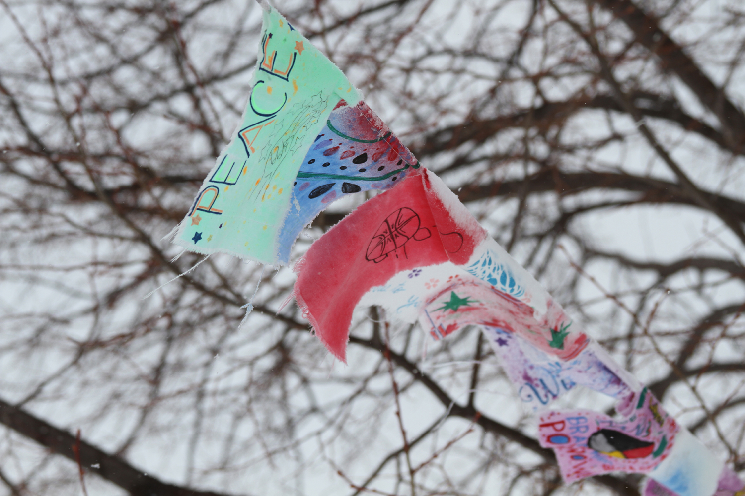 Prayer flags originated in Tibet and are now displayed at St. Joseph’s Indian School. 