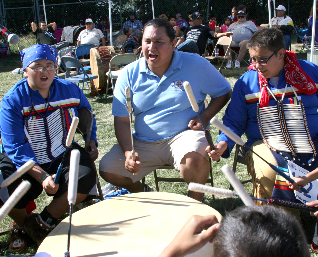 St. Joseph’s drum group, the Chalk Hills Singers, sing with their instructor Jeshua. 