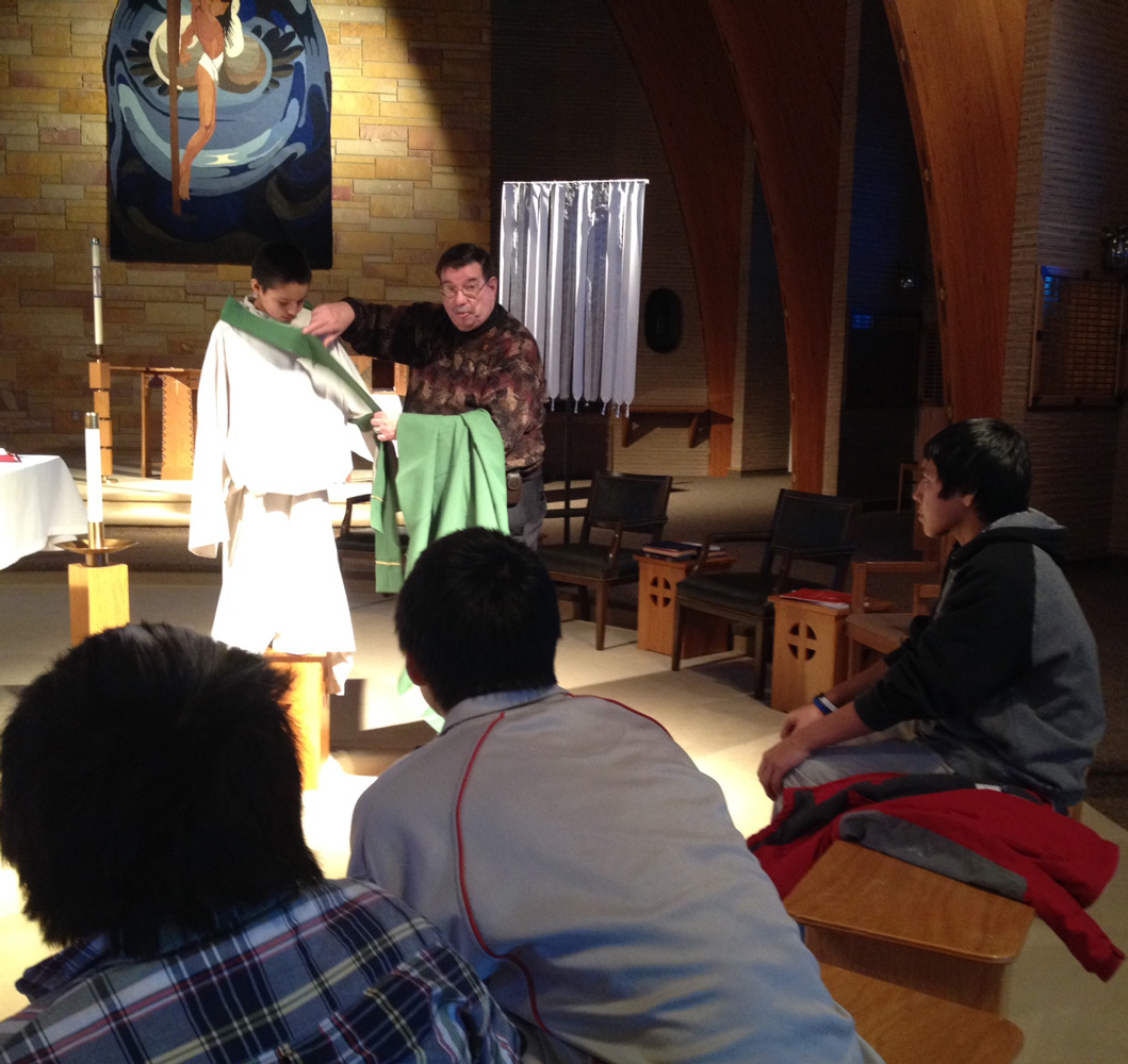 Fr. Anthony, St. Joseph’s Chaplain, shares with the Lakota children during Sacramental Preparation. 