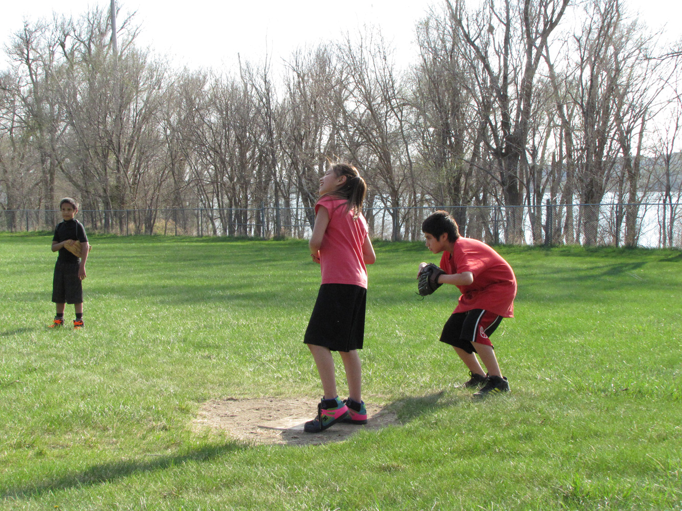 The Lakota children play softball each spring. 