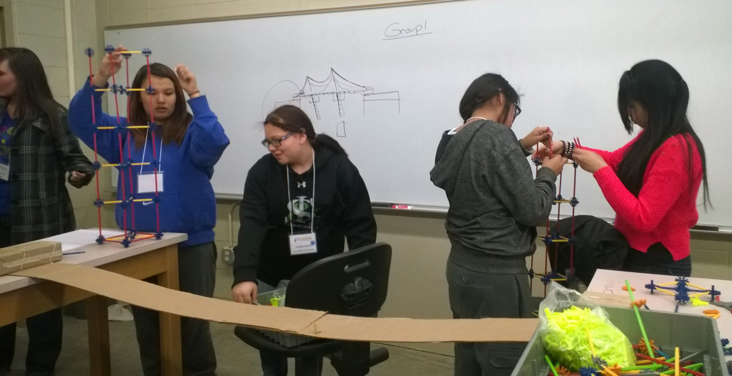 The Lakota girls worked in teams to build a bridge spanning 6 feet using only string, cardboard, two bricks and tinker toys. 