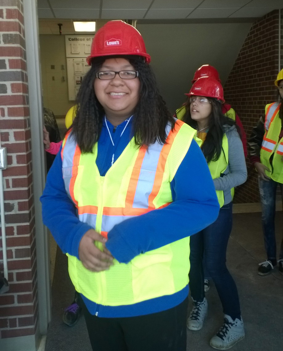 While learning about how buildings are constructed, the girls wore regulation Personal Protective Equipment, or PPE. 