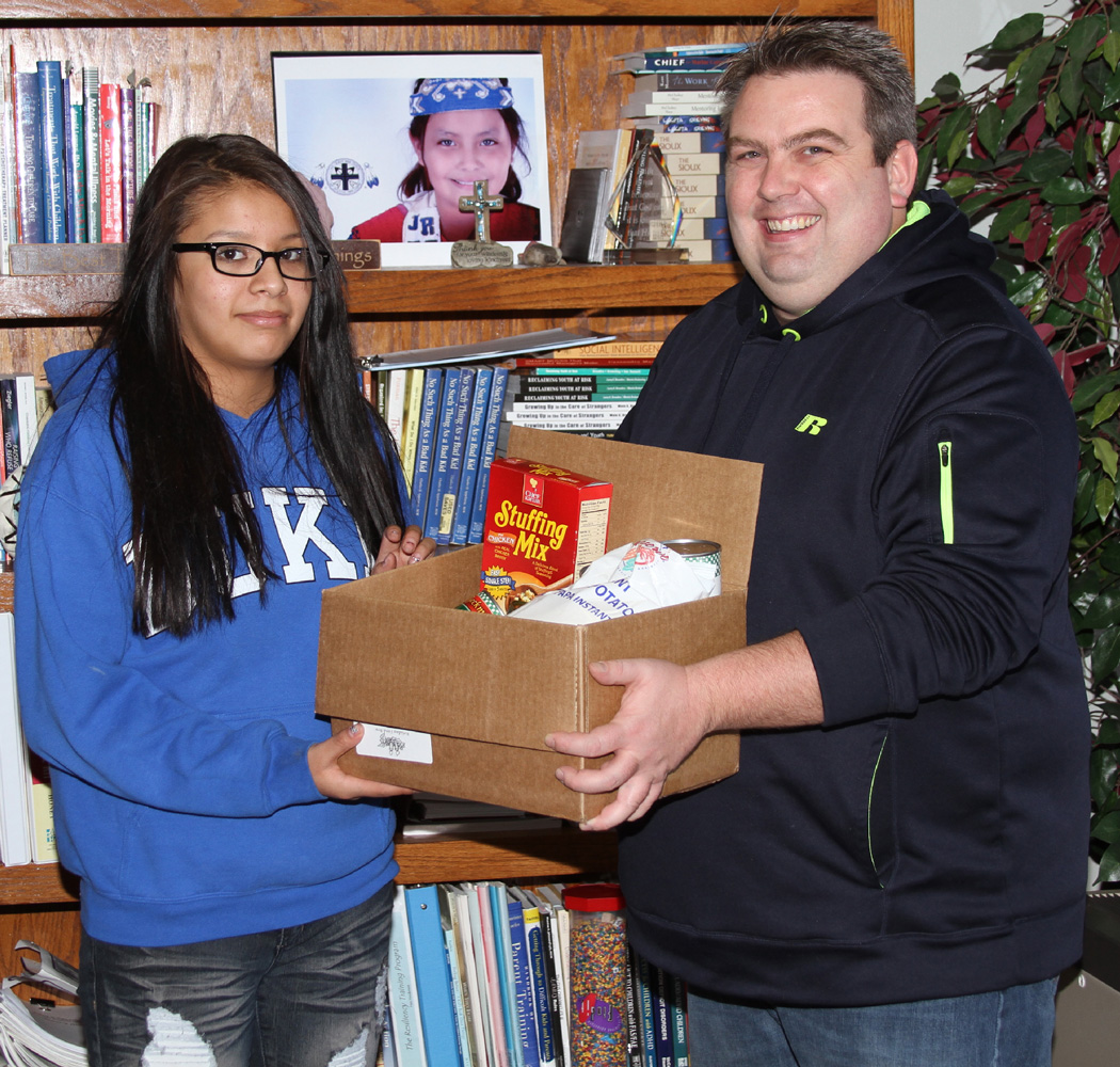 Six Lakota students helped Frank deliver St. Joseph’s donation of food to the local domestic violence shelter. 
