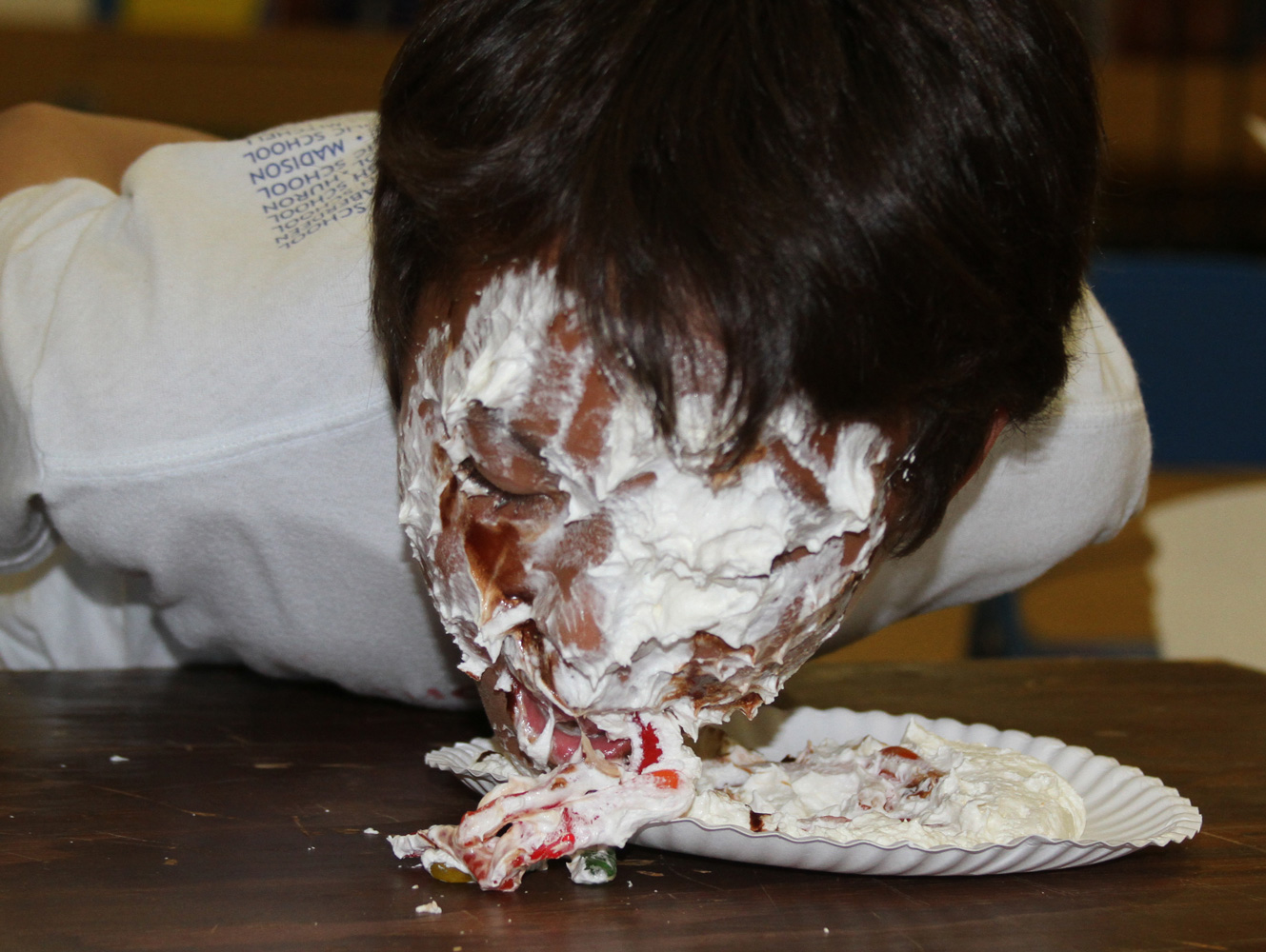 On field day, students fished for gummy worms in a plate of whipped cream and chocolate sauce – no hands! 