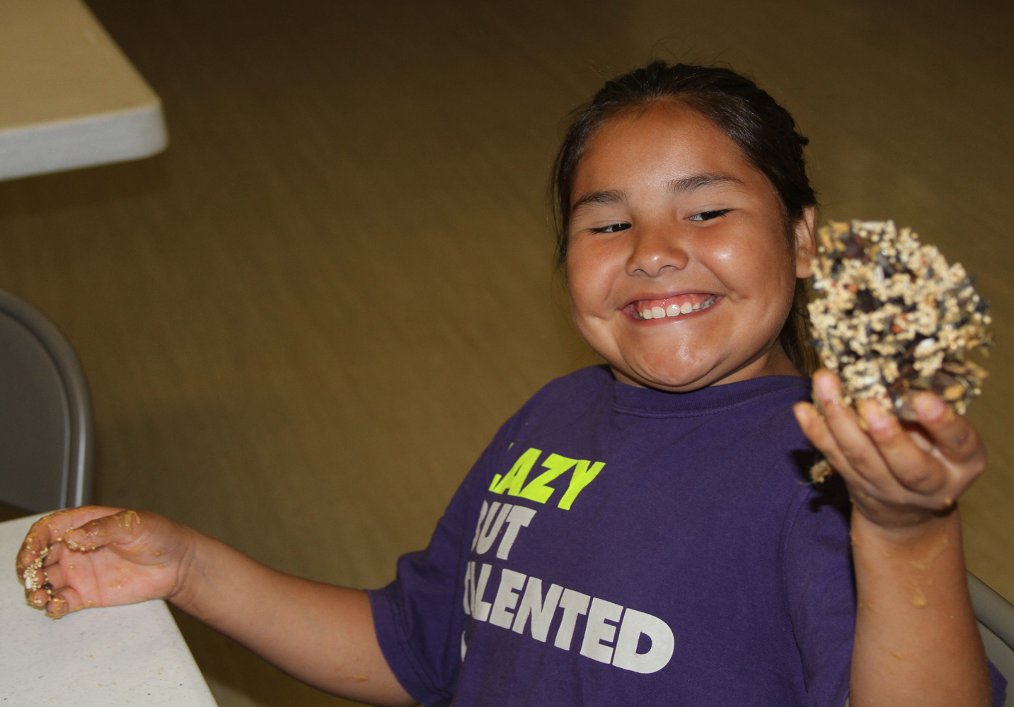 The Lakota children learned to make birdfeeders with pinecones and peanut butter. 