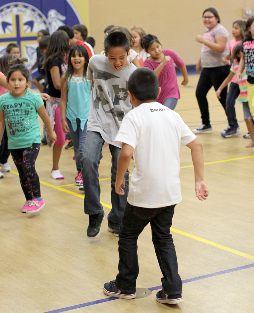 St. Joseph’s students practiced for powwow along with the Black Lodge Singers. 