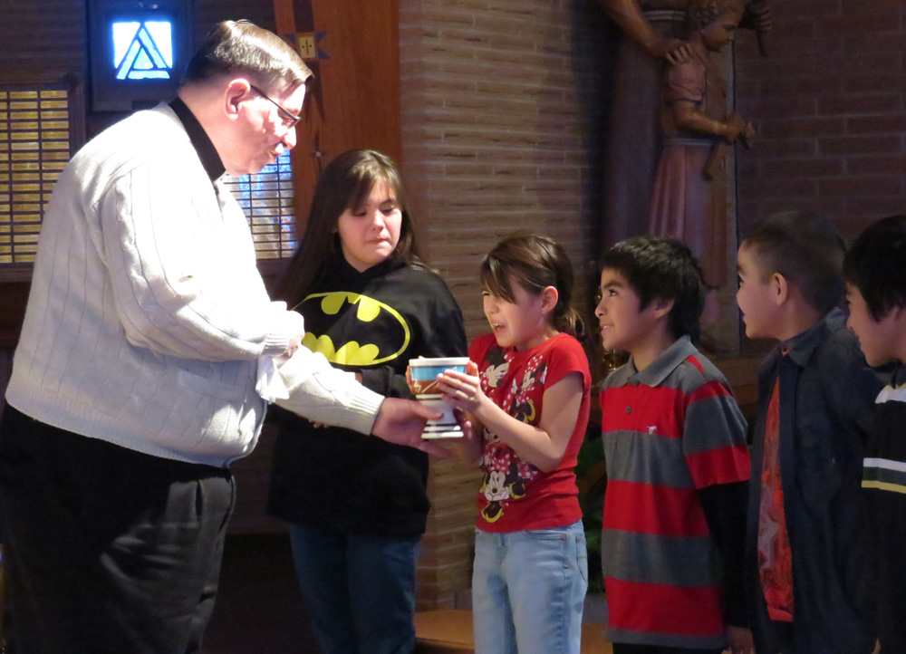 The children preparing for First Communion had a chance to try a sip of wine. 