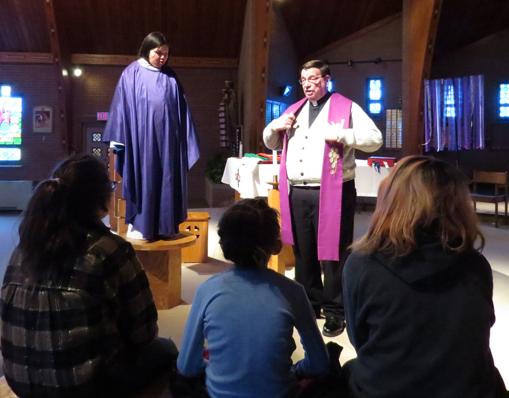 Fr. Anthony explained the vestments, colors, books, chalices and paten, the altar and tabernacle and sanctuary lamp.