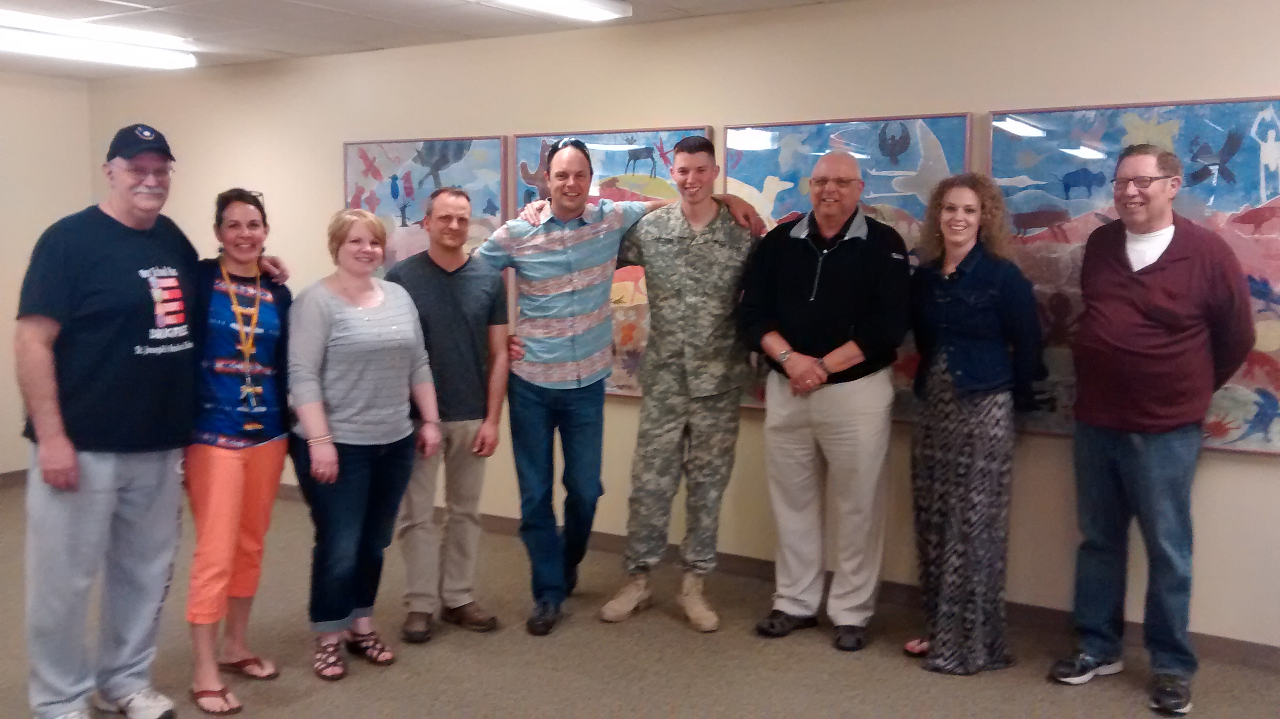 The staff at St. Joseph's posing for a picture with KP.