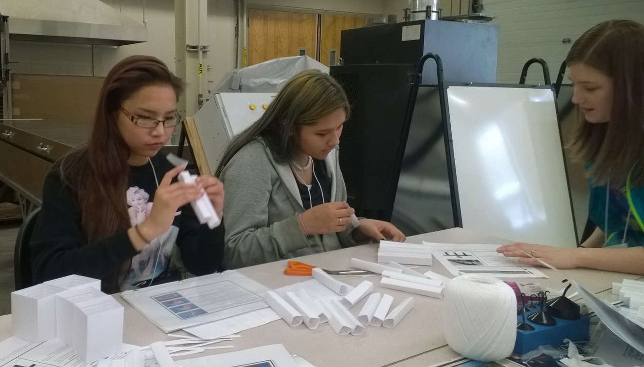 Civil engineering students helped the girls learn about building bridges. 