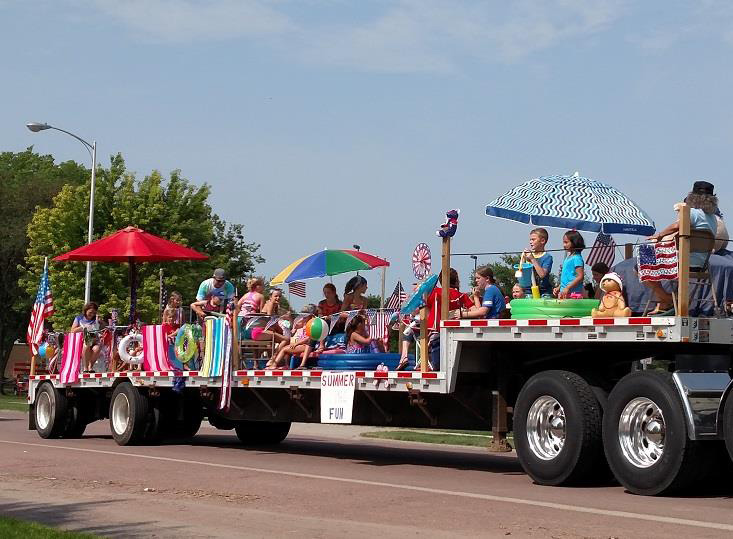 One float in the parade had a “Summer fun” theme, complete with squirt guns to cool off the crowd. 