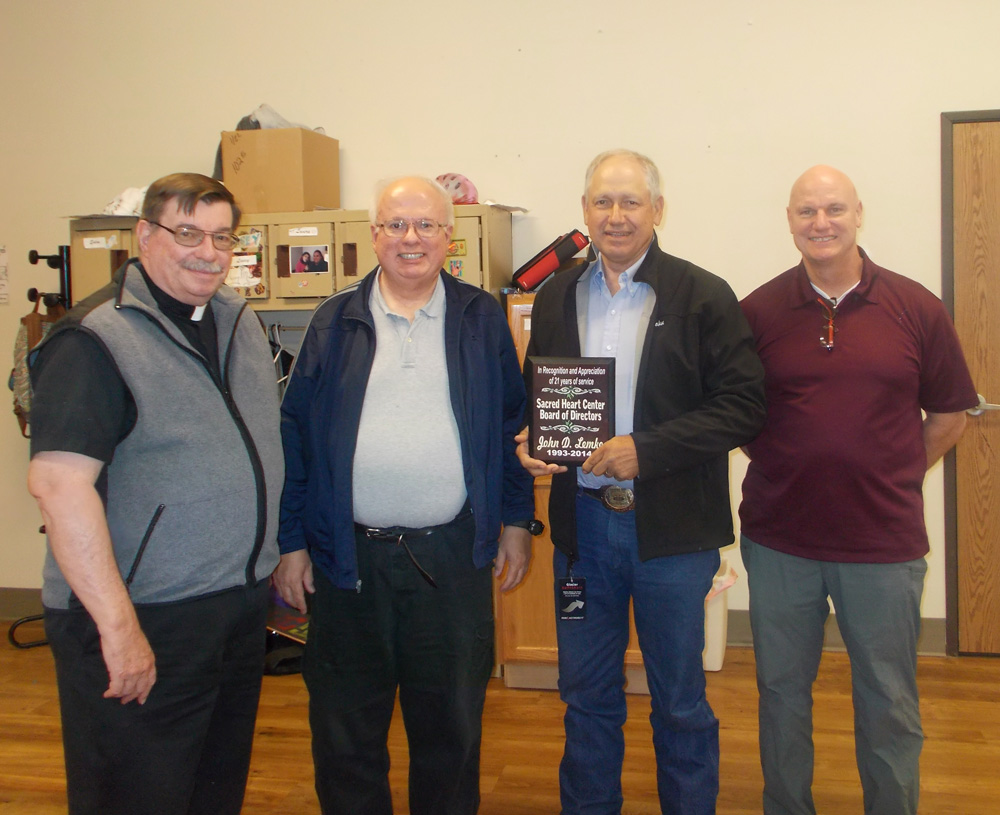 Fr. Anthony, Fr. Joe and Mike were present when John received his award for years of service. 