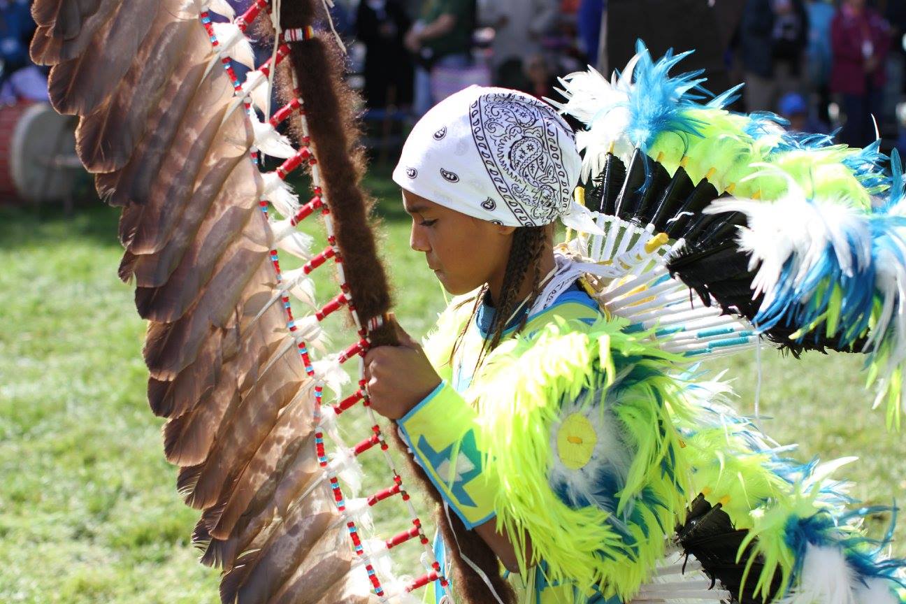 A Lakota (Sioux) student dances at the powwow on Chamberlain, South Dakota's St. Joseph's Indian School Campus. 