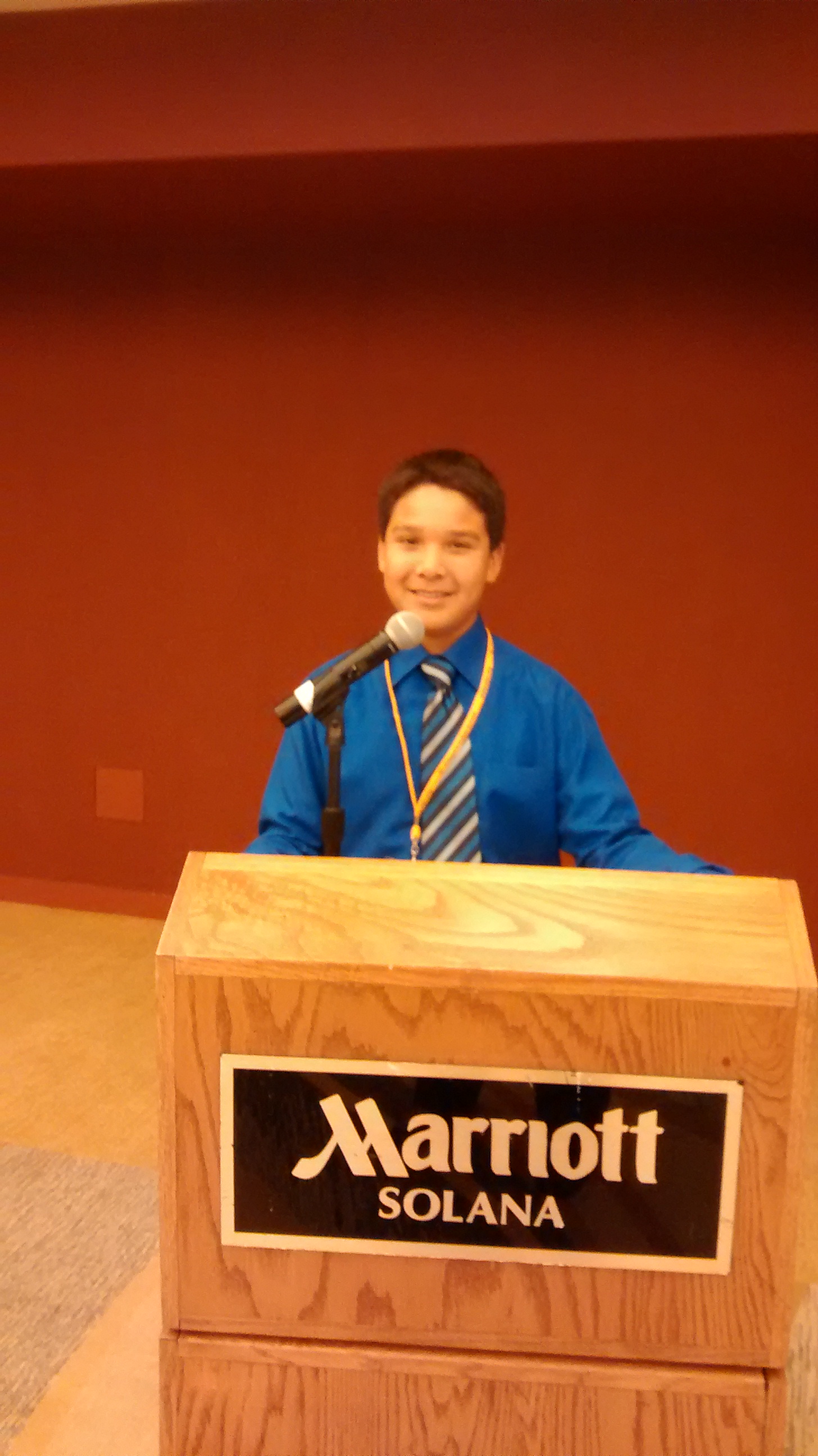 A Lakota (Sioux) student prepares for the donor luncheon. 