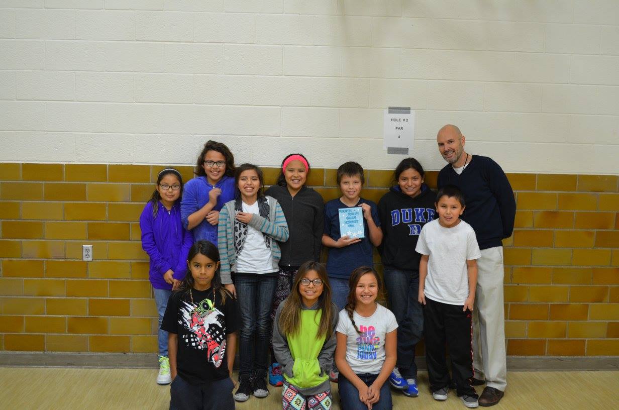 Lakota (Sioux) students with their teacher. 