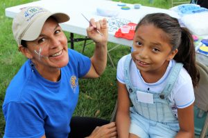 A Native American student gets her face painted during the Back-to-School Picnic at St. Joseph’s Indian School.