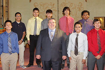 Frank and the boys who graduated from eighth grade in 2017 are pictured in their shirts and ties for the event.
