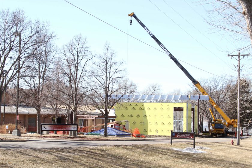 February 2012 – Glulam beams are set as work on the roof begins.
