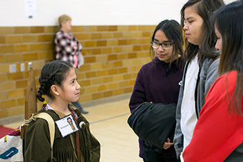 Third graders waited for visitors to push their talk button before reciting their speeches during the wax museum. 